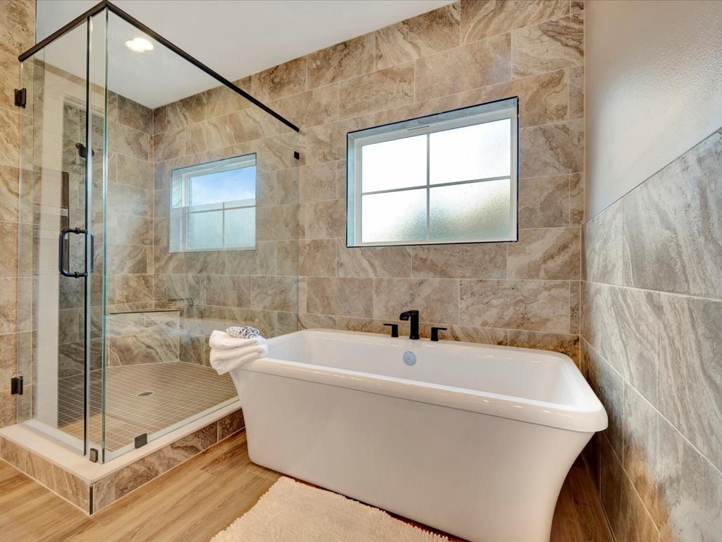 537 C C Road Diboll, TX 75941 - Photo 25 of 37 a white bath tub sitting next to a shower