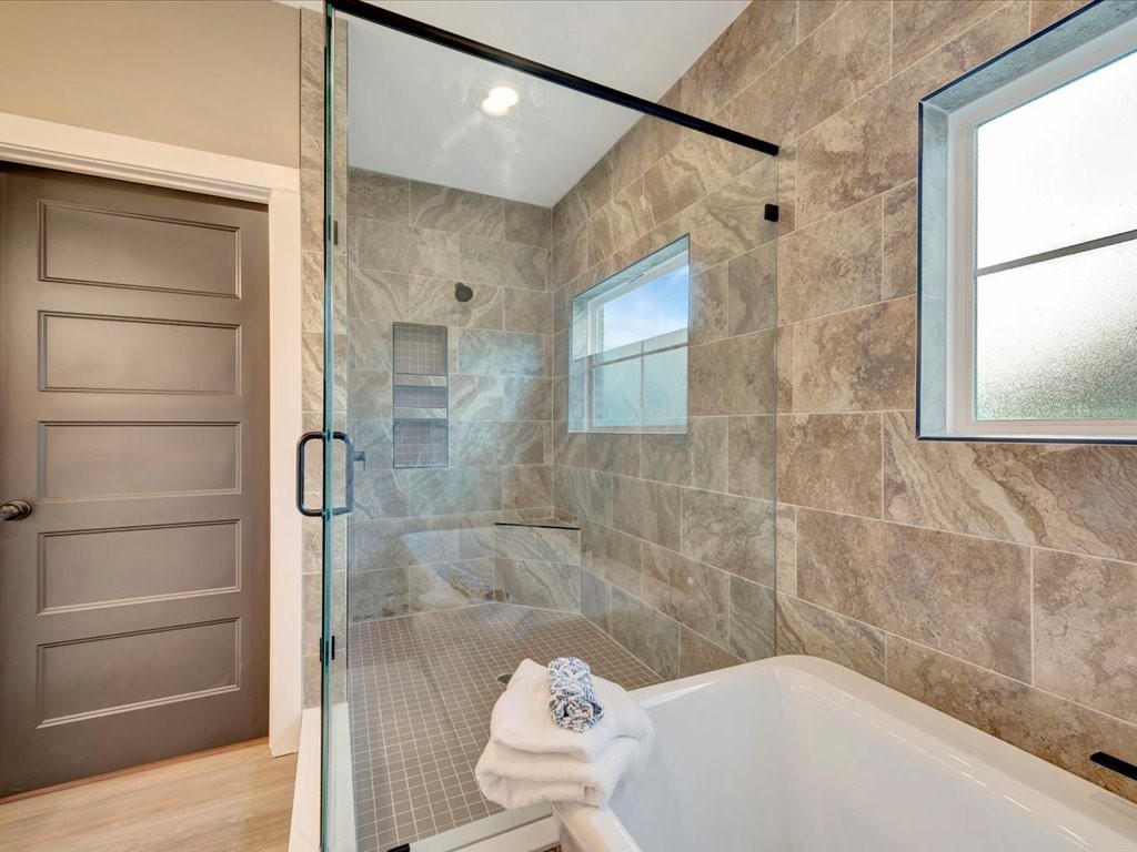 537 C C Road Diboll, TX 75941 - Photo 26 of 37 a bathroom with a bathtub and shower