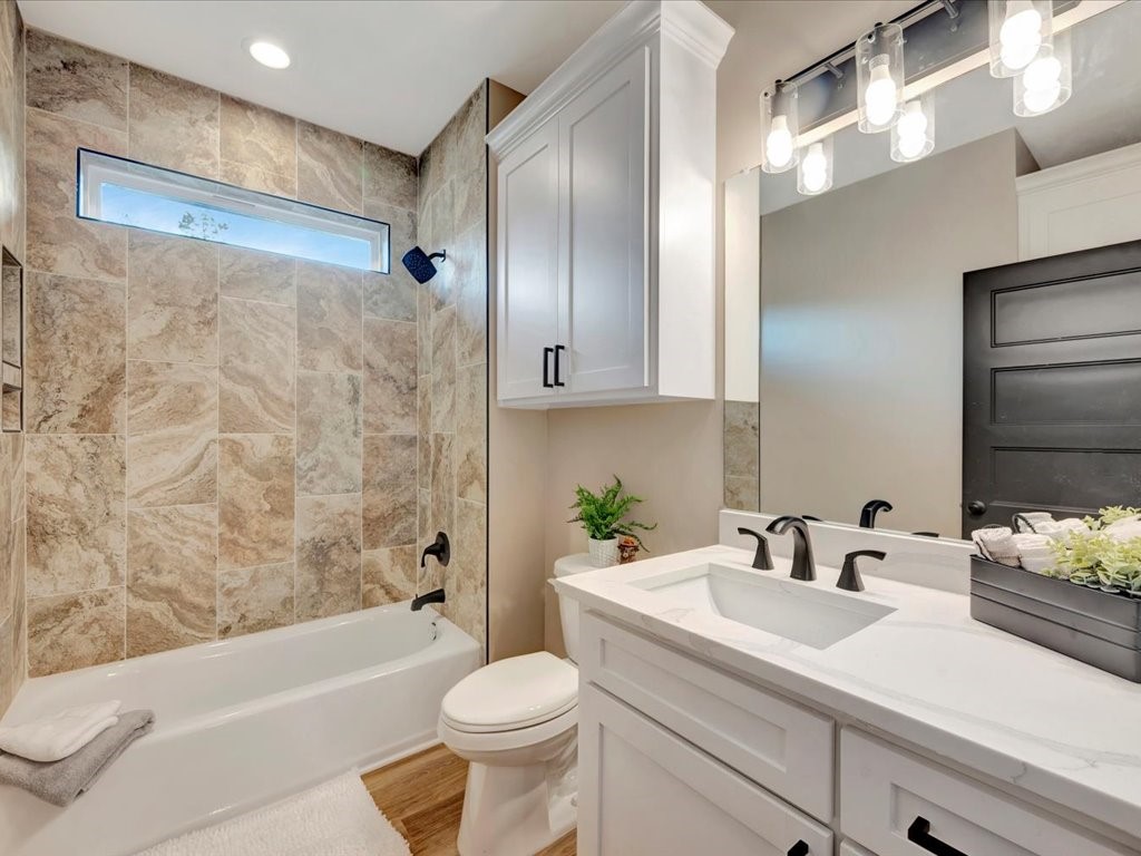 537 C C Road Diboll, TX 75941 - Photo 28 of 37 a bathroom with a sink a toilet and a bathtub