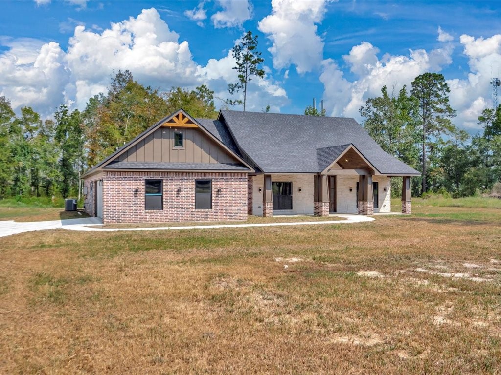 537 C C Road Diboll, TX 75941 - Photo 3 of 37 a front view of a house with garden