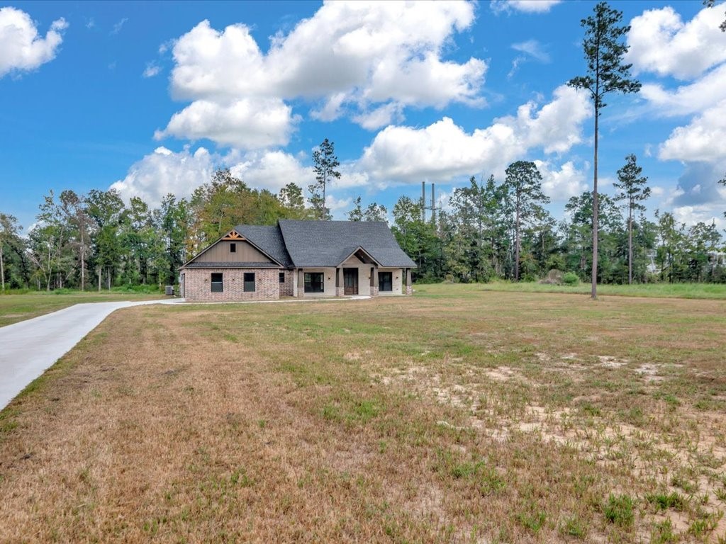 537 C C Road Diboll, TX 75941 - Photo 4 of 37 a front view of a house with garden