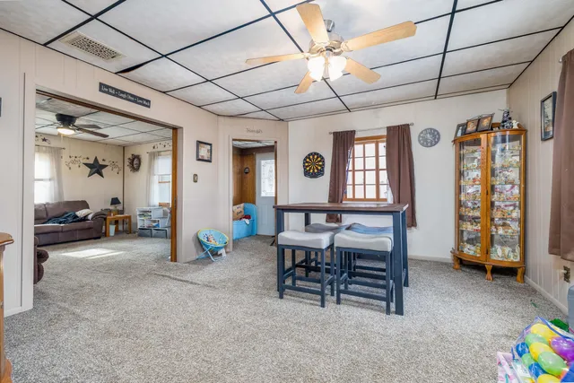 a view of a livingroom with furniture and a window