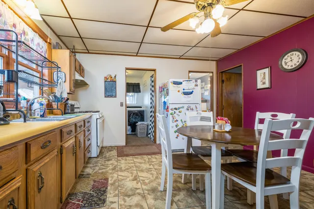 a kitchen with stainless steel appliances granite countertop a sink and cabinets