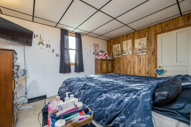 a bed room with a bed and a couch