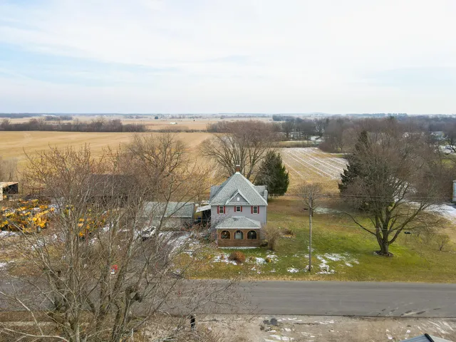 a view of a lake with houses in the back