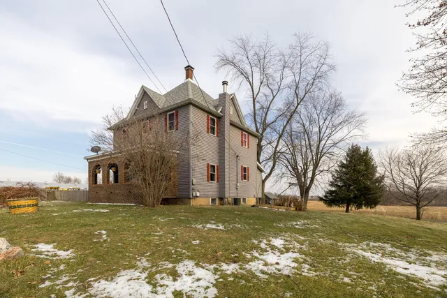 a front view of house with garden