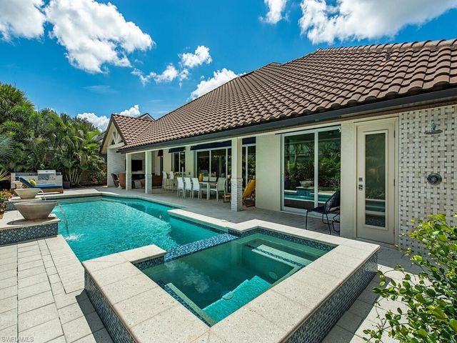 a view of a house with a yard porch and sitting area