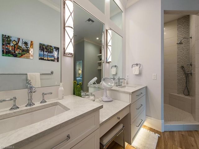 a bathroom with a double vanity sink mirror and double