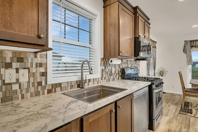 a kitchen with a stove and a microwave