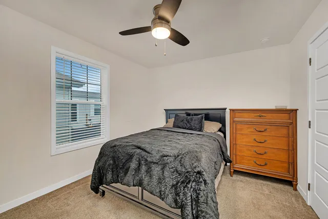 an empty room with a fan