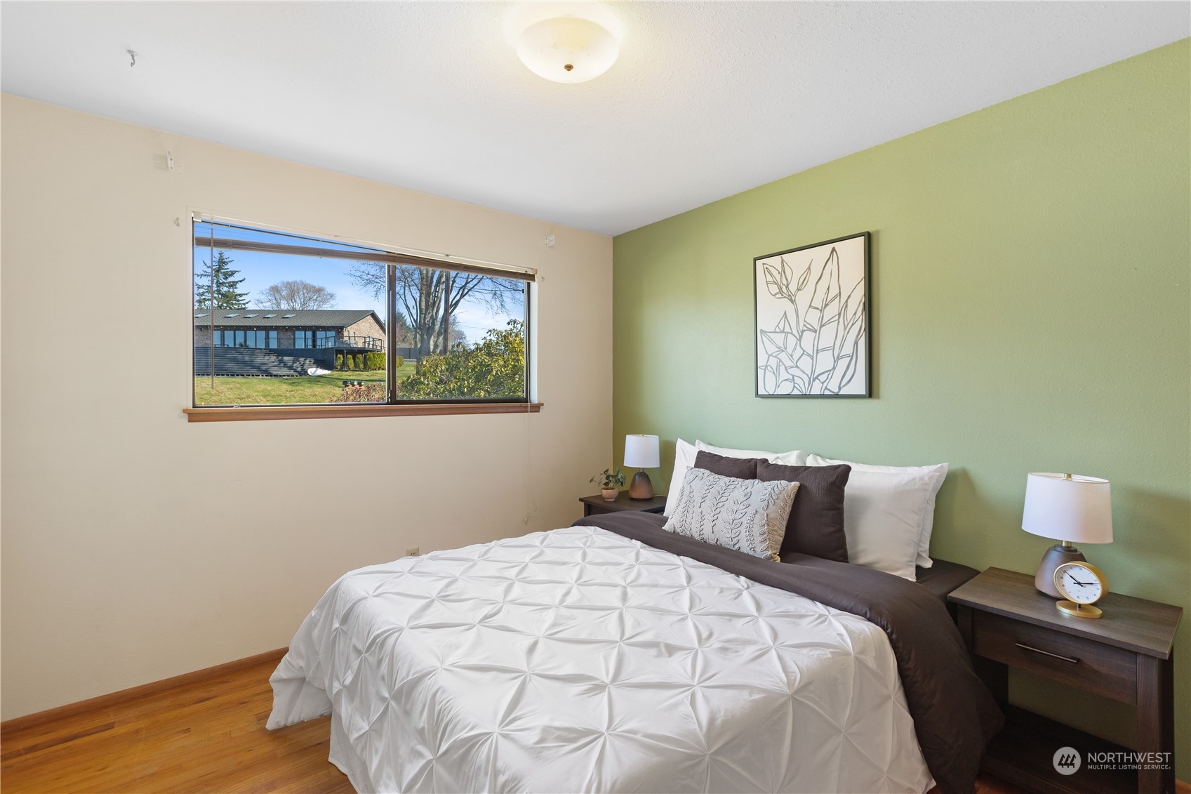 5102 Fobes Road Snohomish, WA 98290 - Photo 18 of 40 a bedroom with a bed and a painting on the wall
