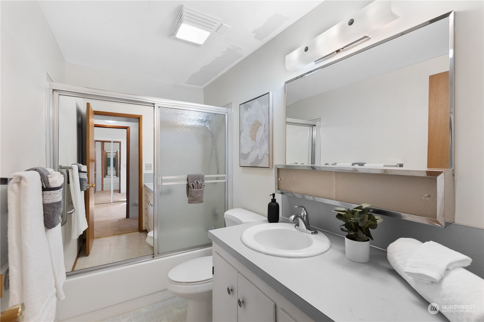 5102 Fobes Road Snohomish, WA 98290 - Photo 21 of 40 a bathroom with a sink a toilet and shower