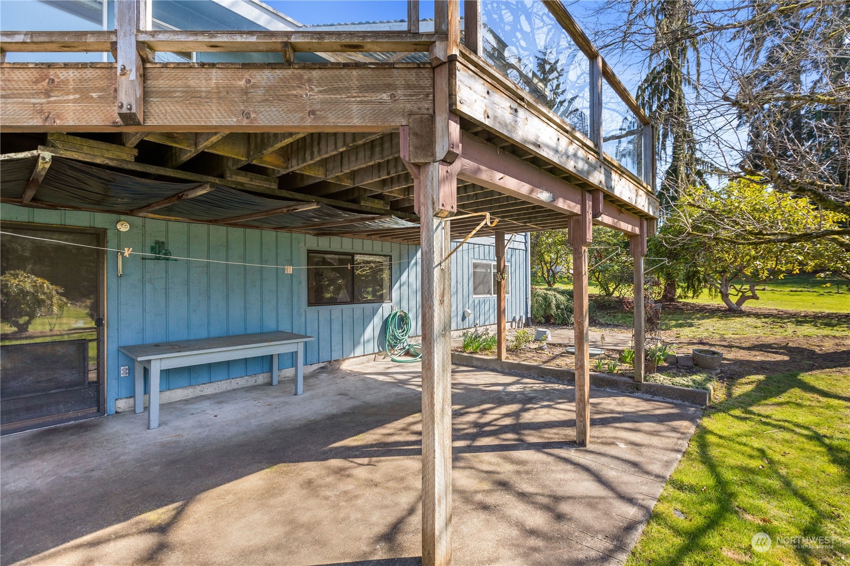 5102 Fobes Road Snohomish, WA 98290 - Photo 32 of 40 a view of a patio with table and chairs and wooden fence