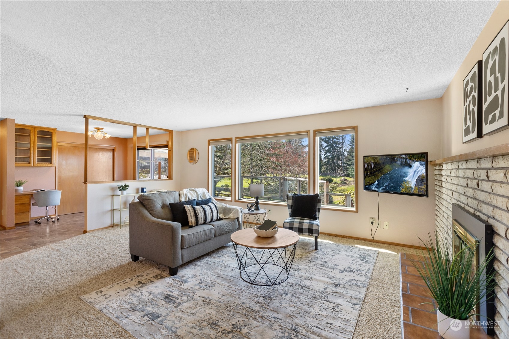5102 Fobes Road Snohomish, WA 98290 - Photo 6 of 40 a living room with fireplace furniture and a flat screen tv