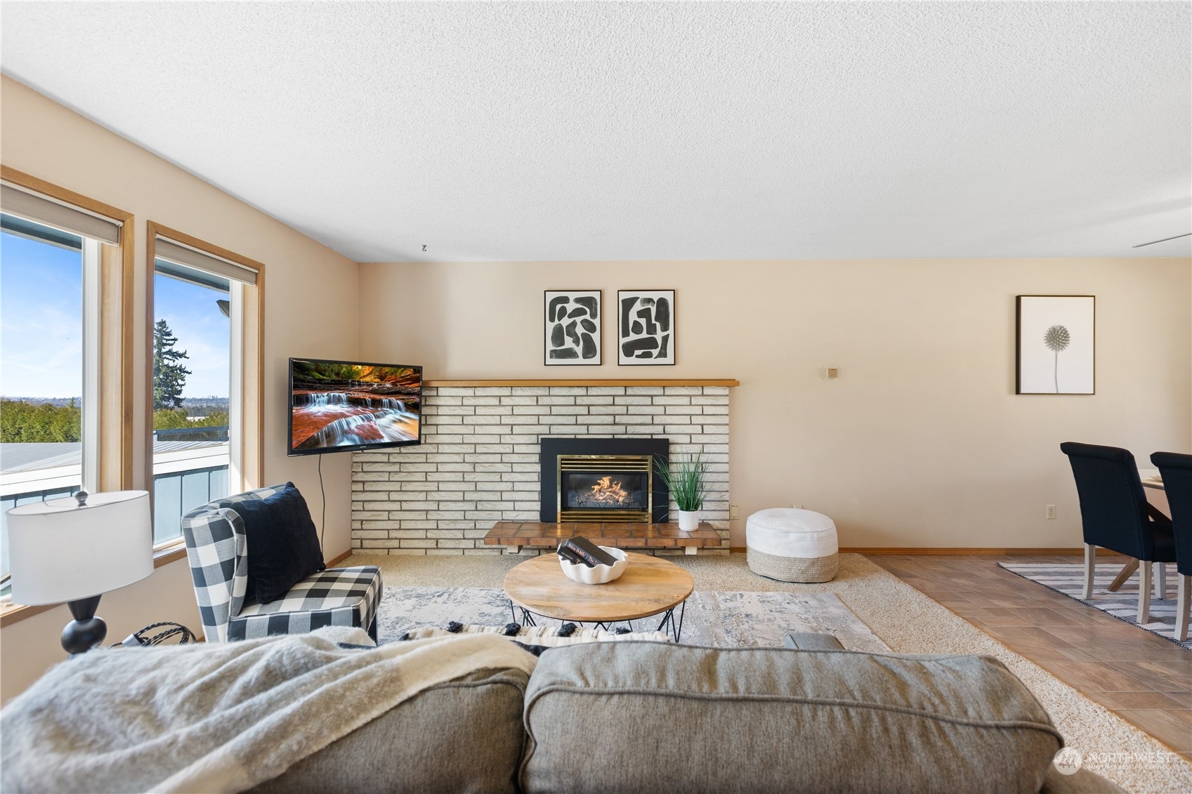 5102 Fobes Road Snohomish, WA 98290 - Photo 8 of 40 a living room with furniture a fireplace and a large window