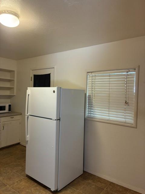 2823 Blair Road Pollock Pines, CA 95726 - Photo 15 of 15 a white refrigerator freezer and a stove sitting inside of a kitchen
