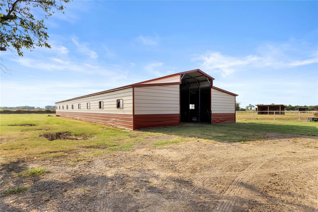 777 Stiles Road Whitesboro, TX 76273 - Photo 32 of 37 a front view of a house with a yard
