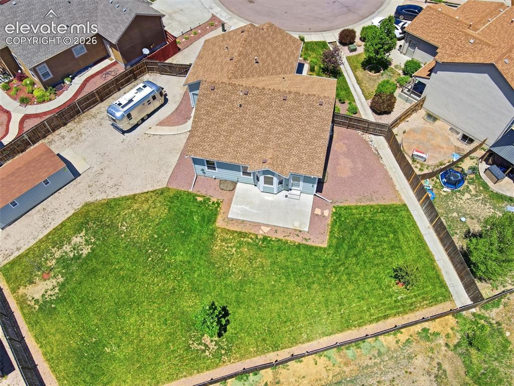 7806 Dutch Loop Colorado Springs, CO 80925 - Photo 39 of 41 an aerial view of a house with garden