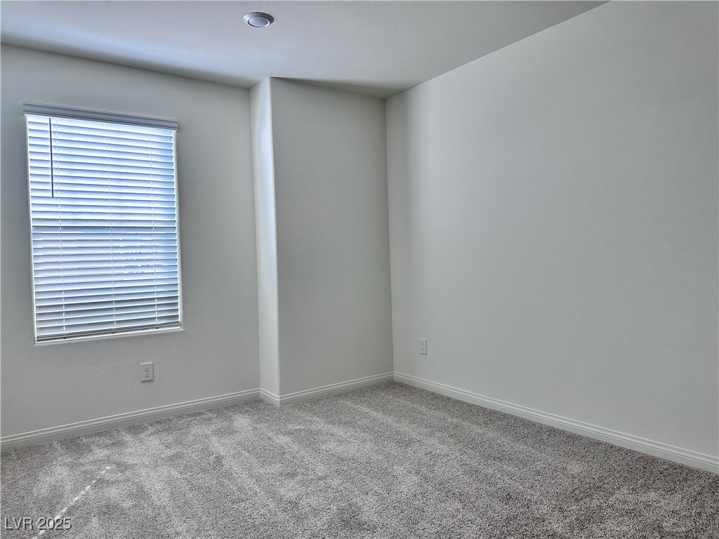 3634 Cameri Avenue Henderson, NV 89044 - Photo 11 of 22 Carpeted empty room featuring baseboards