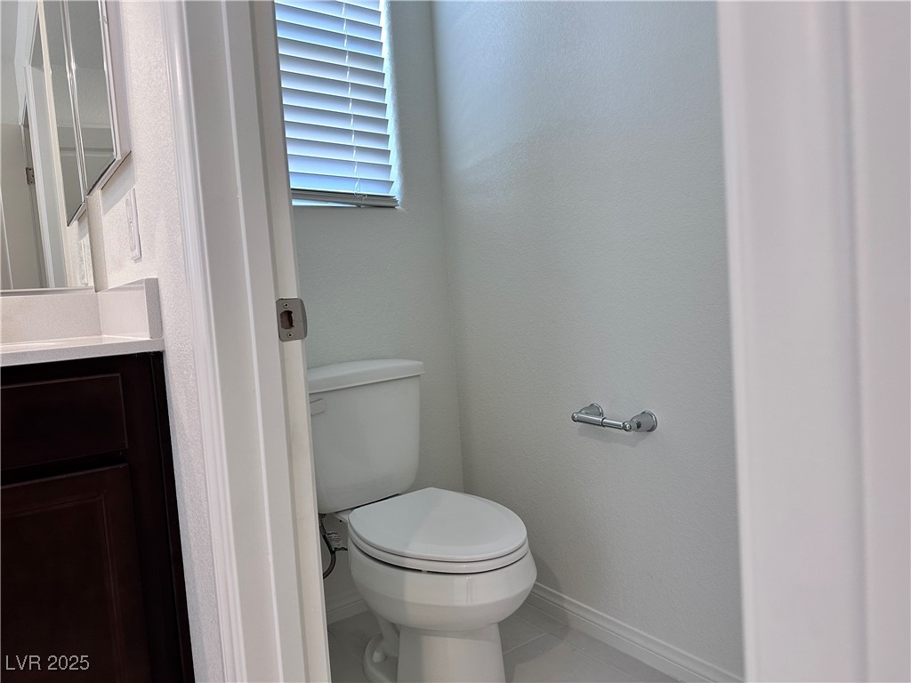 3634 Cameri Avenue Henderson, NV 89044 - Photo 20 of 22 Bathroom featuring tile patterned floors and vanity