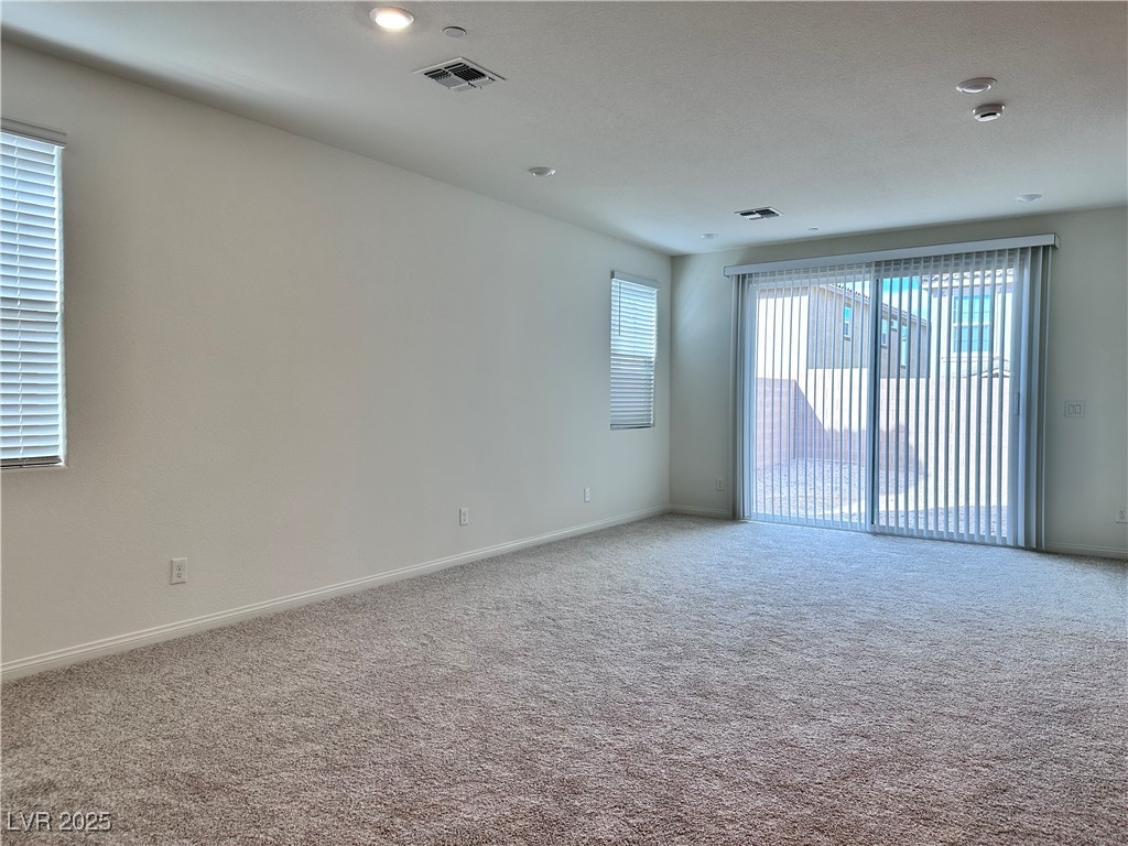 3634 Cameri Avenue Henderson, NV 89044 - Photo 3 of 22 Unfurnished room with carpet flooring and recessed lighting