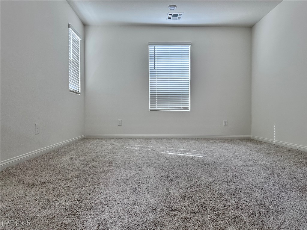 3634 Cameri Avenue Henderson, NV 89044 - Photo 9 of 22 Carpeted empty room featuring baseboards