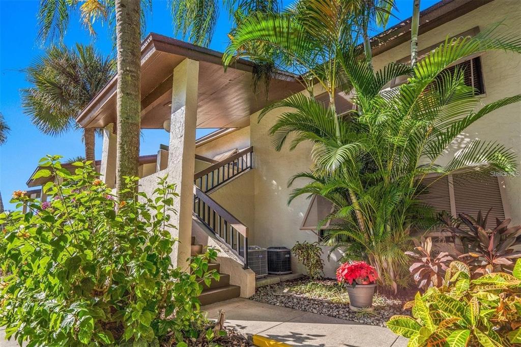 5147 Willow Links, Unit 18 Sarasota, FL 34235 - Photo 1 of 30 a view of path along with potted plants