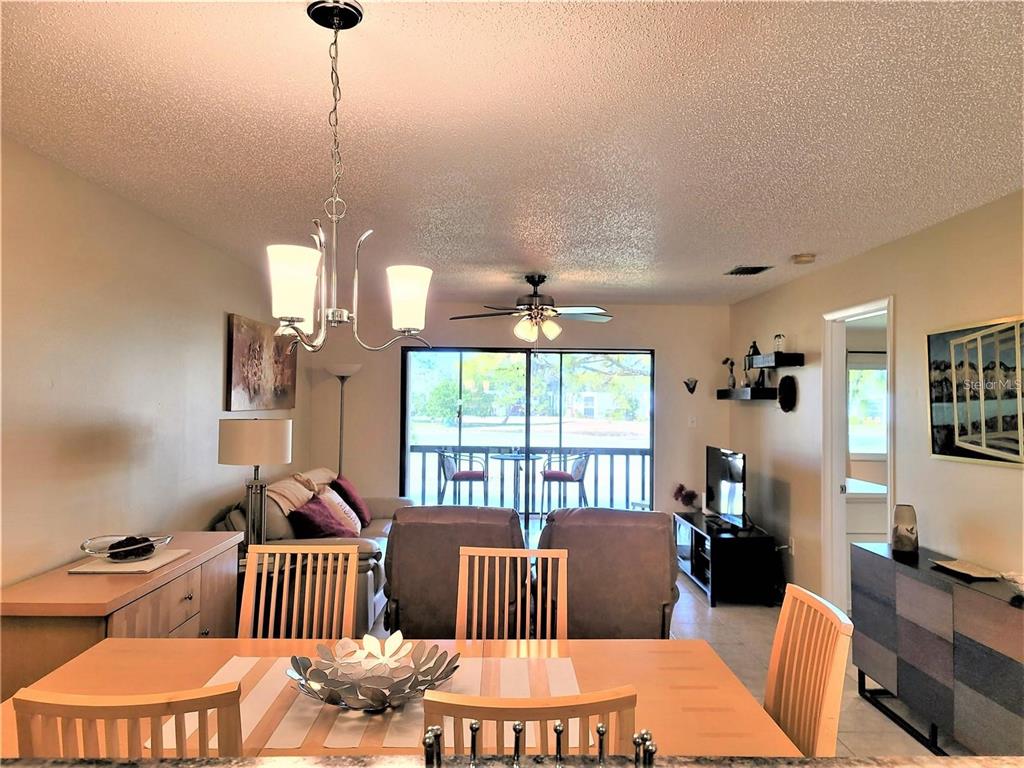 5147 Willow Links, Unit 18 Sarasota, FL 34235 - Photo 14 of 30 a bedroom with furniture and a window