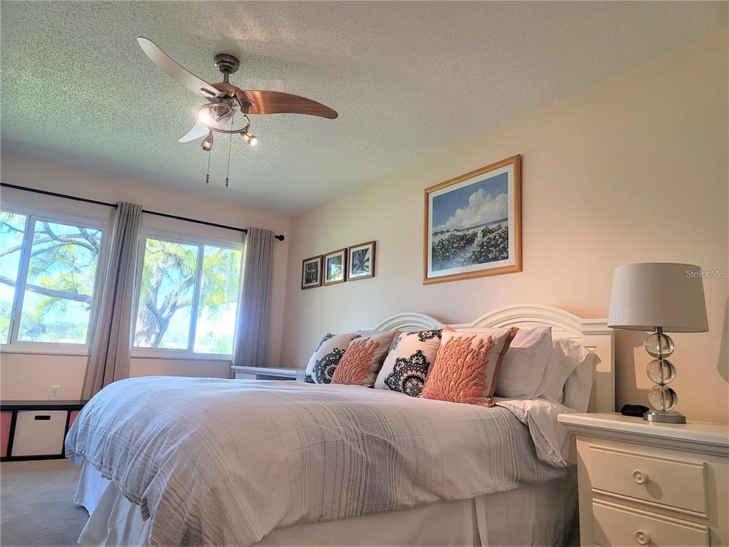 5147 Willow Links, Unit 18 Sarasota, FL 34235 - Photo 23 of 30 a bedroom with a bed and a window