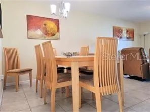 a bedroom with furniture and a painting