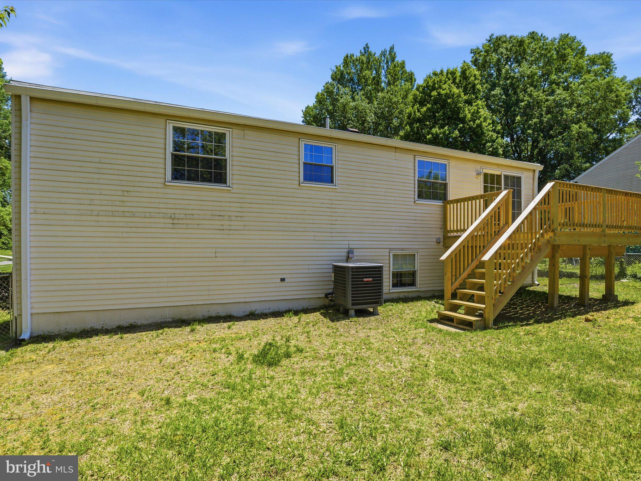 6314 West Vein Road Bowie, MD 20720 - Photo 28 of 28 a view of a backyard with plants and a bench