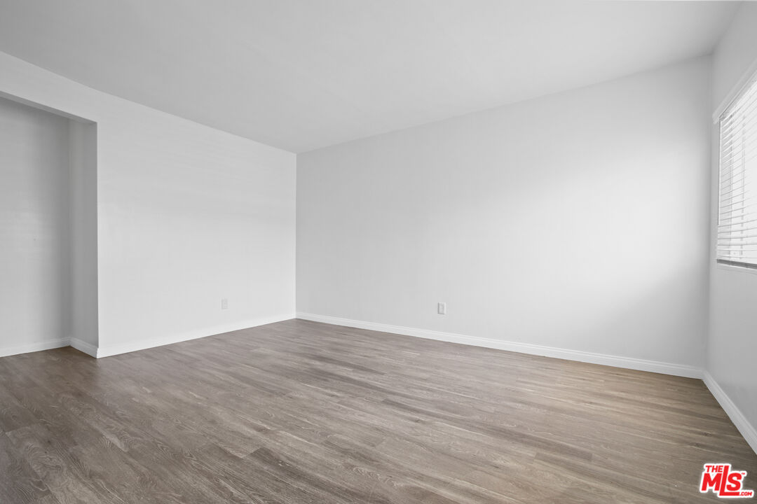 115 North Oak Street, Unit 15 Inglewood, CA 90301 - Photo 12 of 16 a view of an empty room with wooden floor