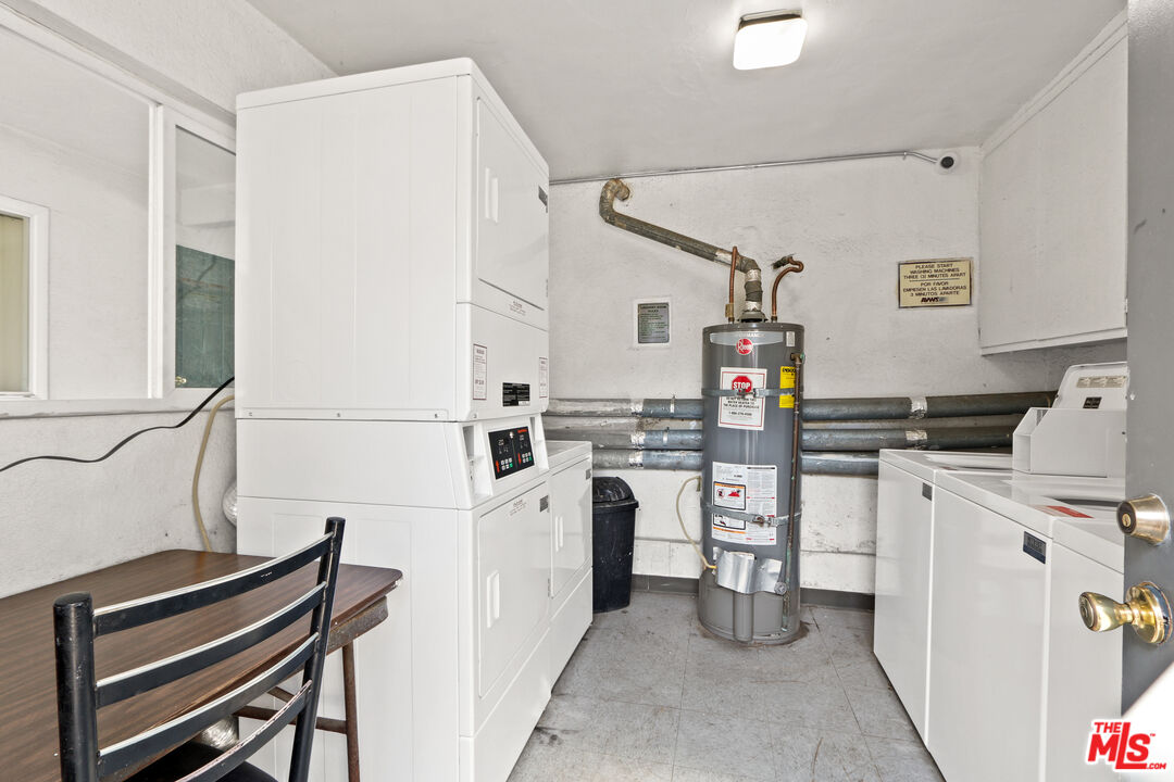 115 North Oak Street, Unit 15 Inglewood, CA 90301 - Photo 5 of 16 a kitchen with stainless steel appliances and white cabinets