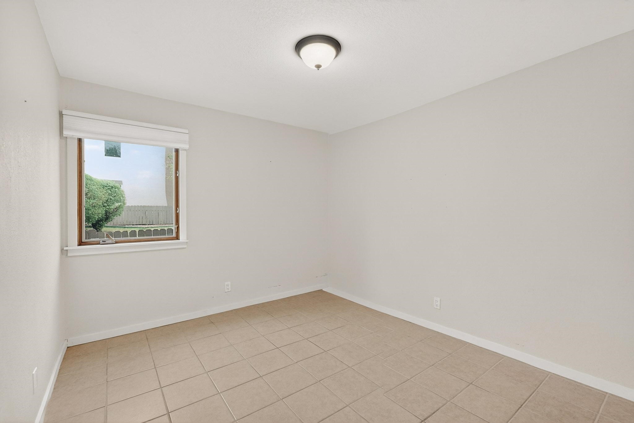 601 West San Mateo Road, Unit 27 Santa Fe, NM 87505 - Photo 22 of 27 Bedroom 2 - Unstaged