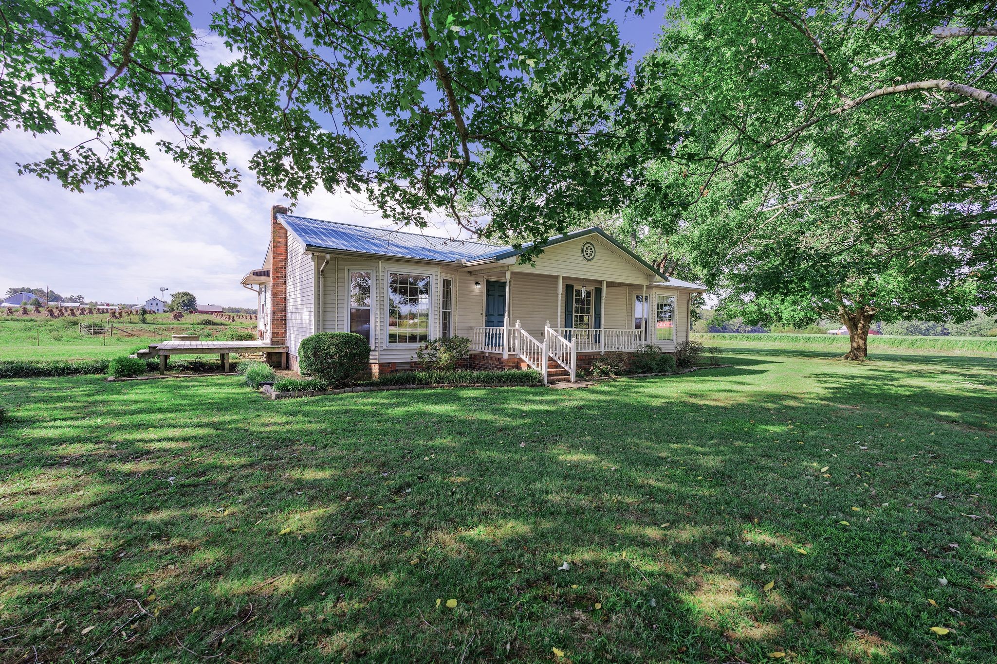 155 Marcella Falls Road Ethridge, TN 38456 - Photo 1 of 33 a front view of a house with a yard table and chairs