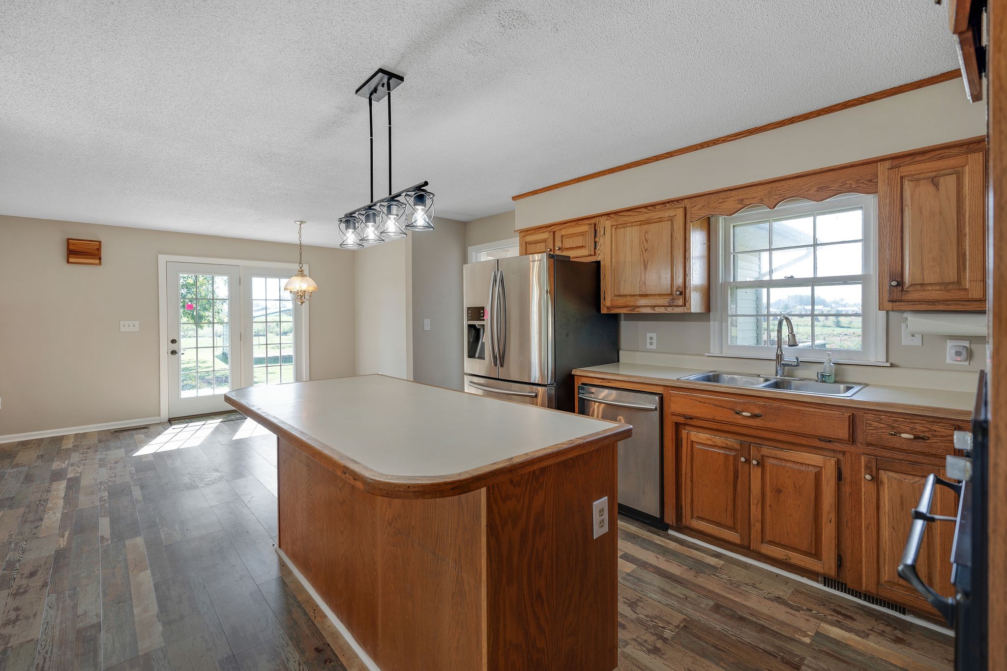 155 Marcella Falls Road Ethridge, TN 38456 - Photo 11 of 33 a kitchen with stainless steel appliances granite countertop a sink stove and refrigerator