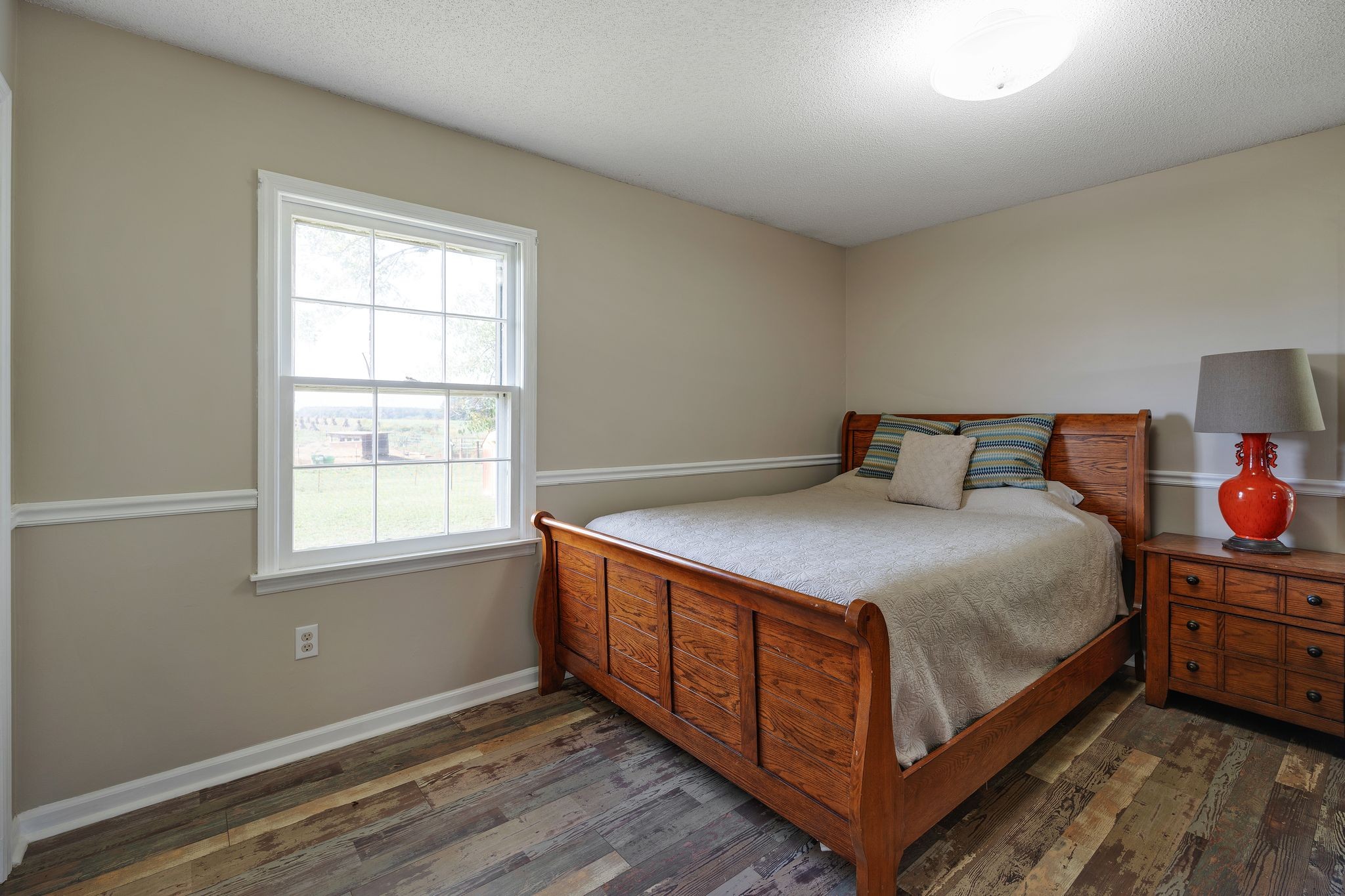155 Marcella Falls Road Ethridge, TN 38456 - Photo 17 of 33 a bedroom with a bed and window