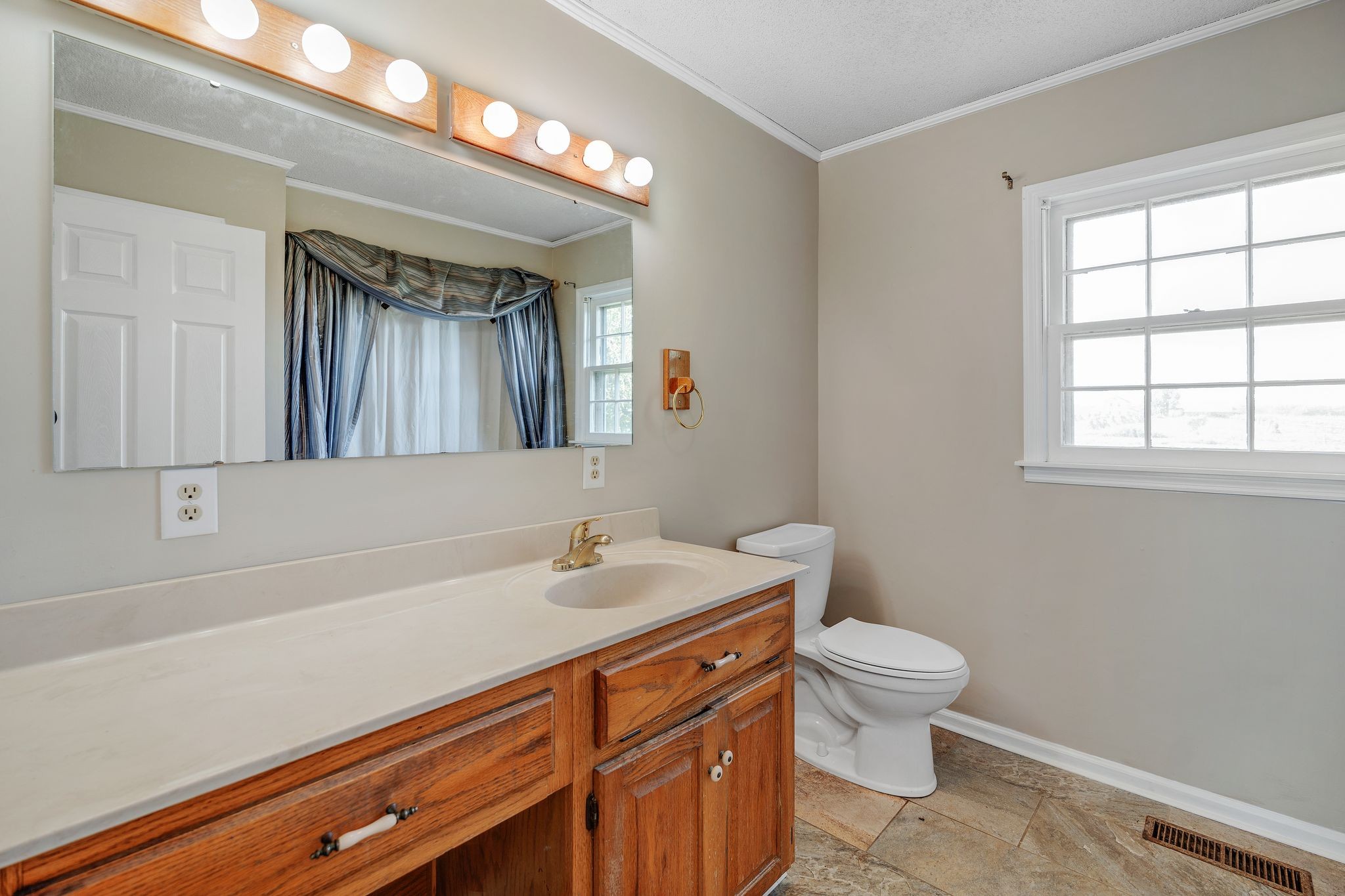155 Marcella Falls Road Ethridge, TN 38456 - Photo 20 of 33 a bathroom with a sink a toilet and a mirror