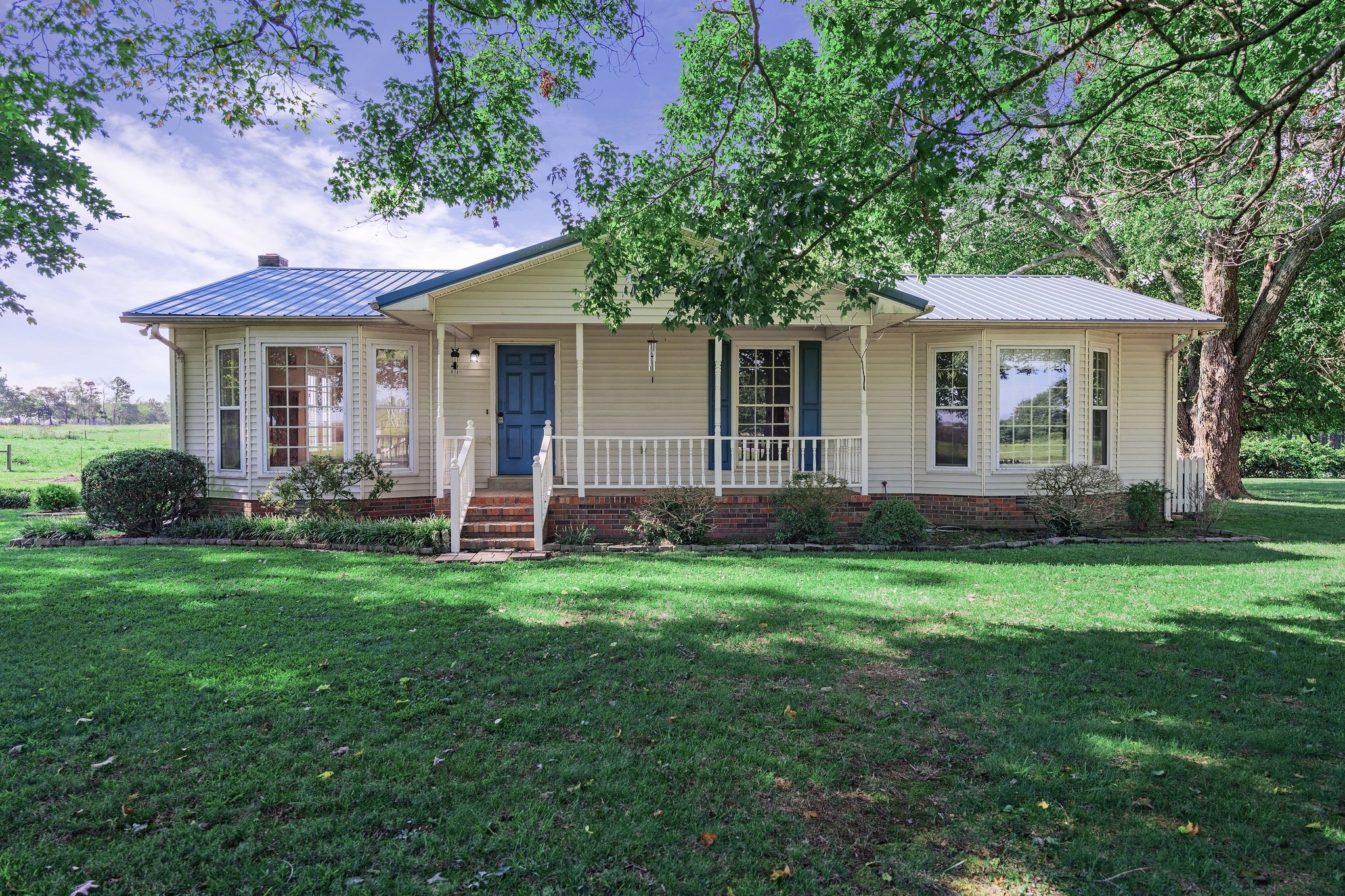 155 Marcella Falls Road Ethridge, TN 38456 - Photo 2 of 33 a view of a house with a yard and potted plants