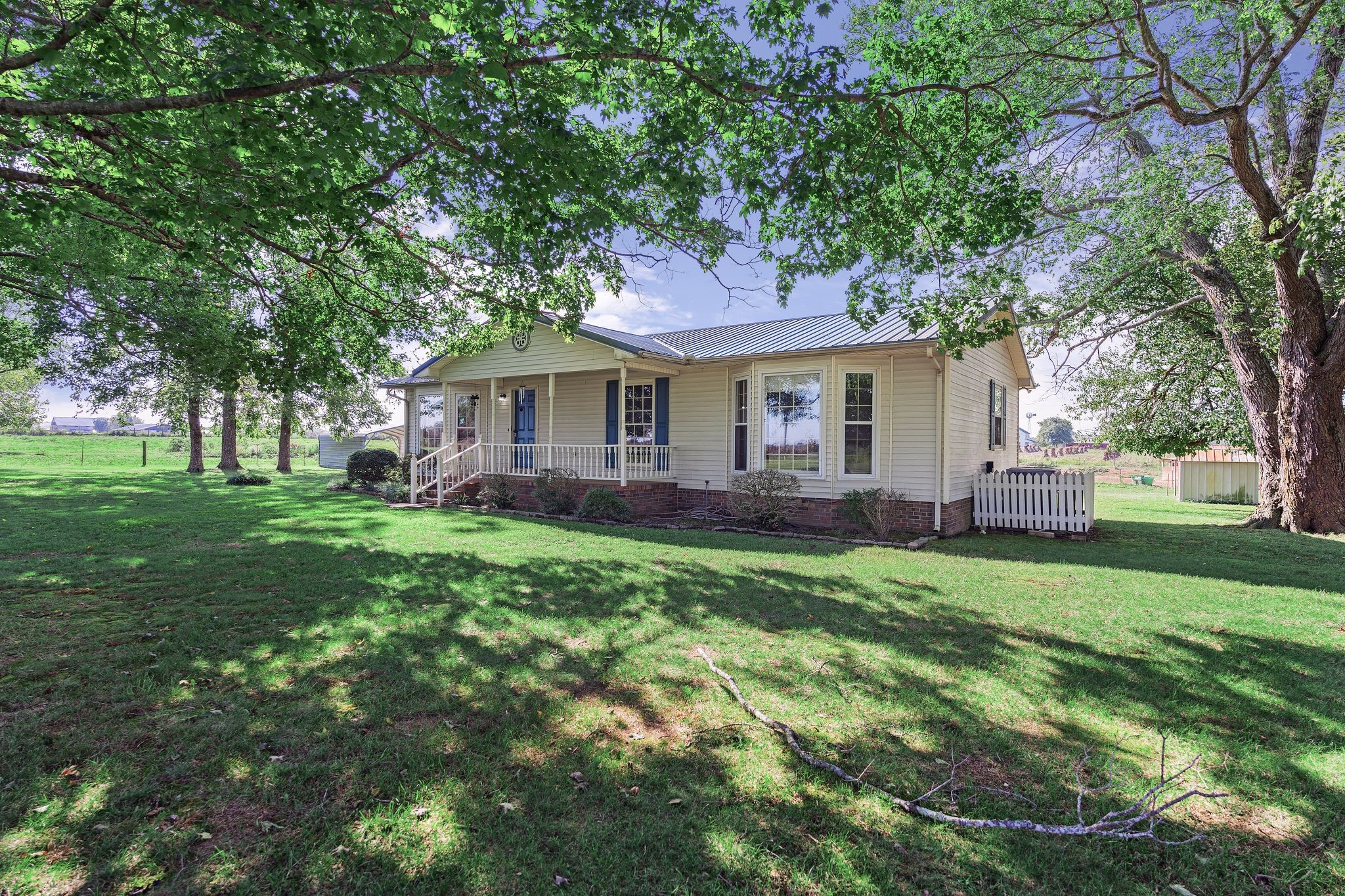 155 Marcella Falls Road Ethridge, TN 38456 - Photo 5 of 33 a front view of a house with a garden