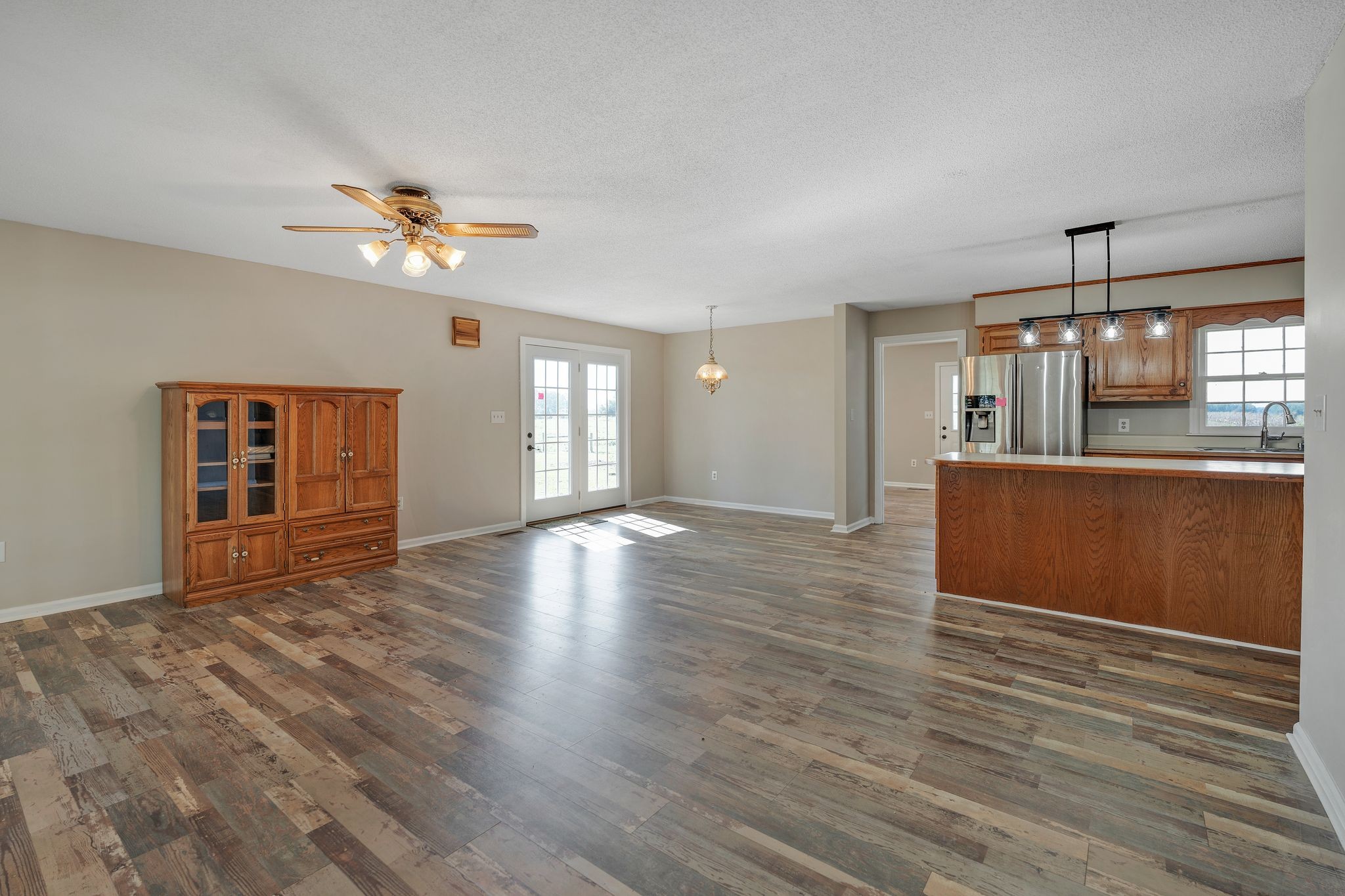 155 Marcella Falls Road Ethridge, TN 38456 - Photo 7 of 33 a view of an empty room with a window and wooden floor