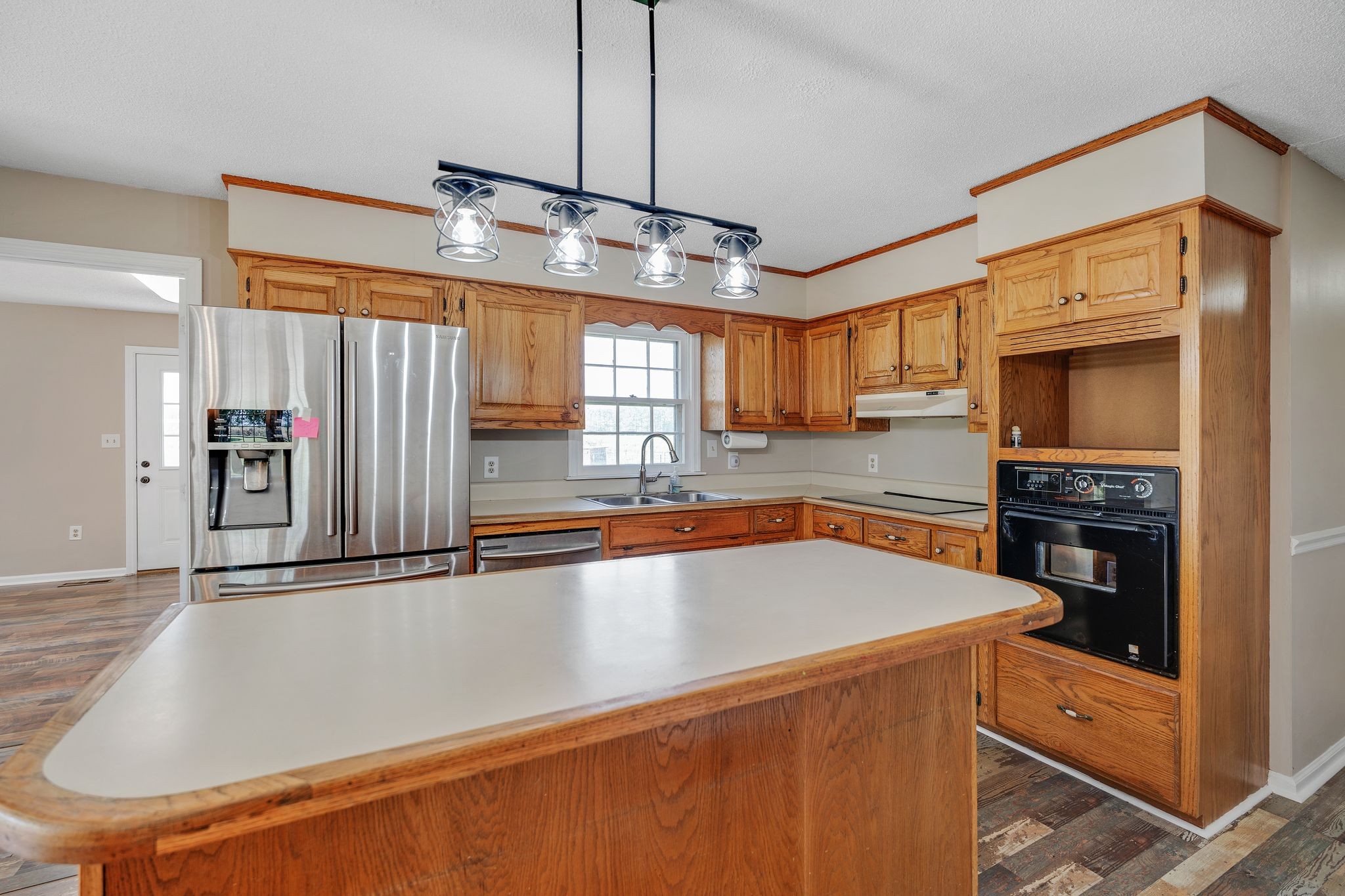 155 Marcella Falls Road Ethridge, TN 38456 - Photo 10 of 33 a kitchen with stainless steel appliances granite countertop a sink a stove and a refrigerator