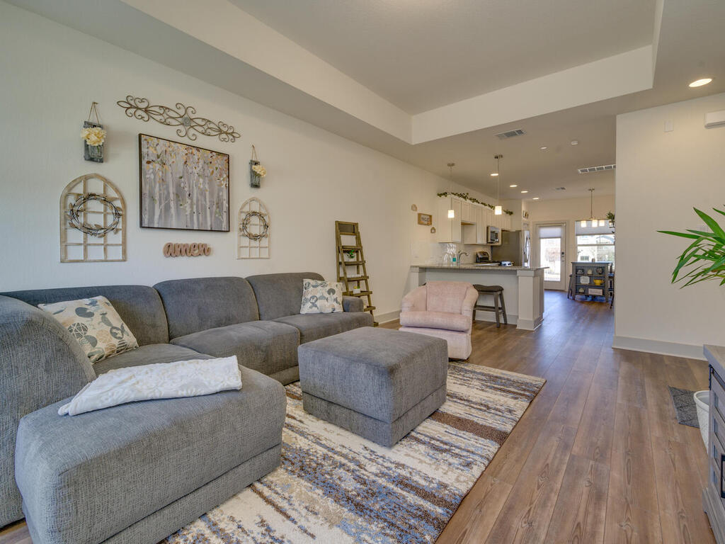 2257 Local Rebel Loop Leander, TX 78641 - Photo 4 of 26 a living room with furniture and a wooden floor