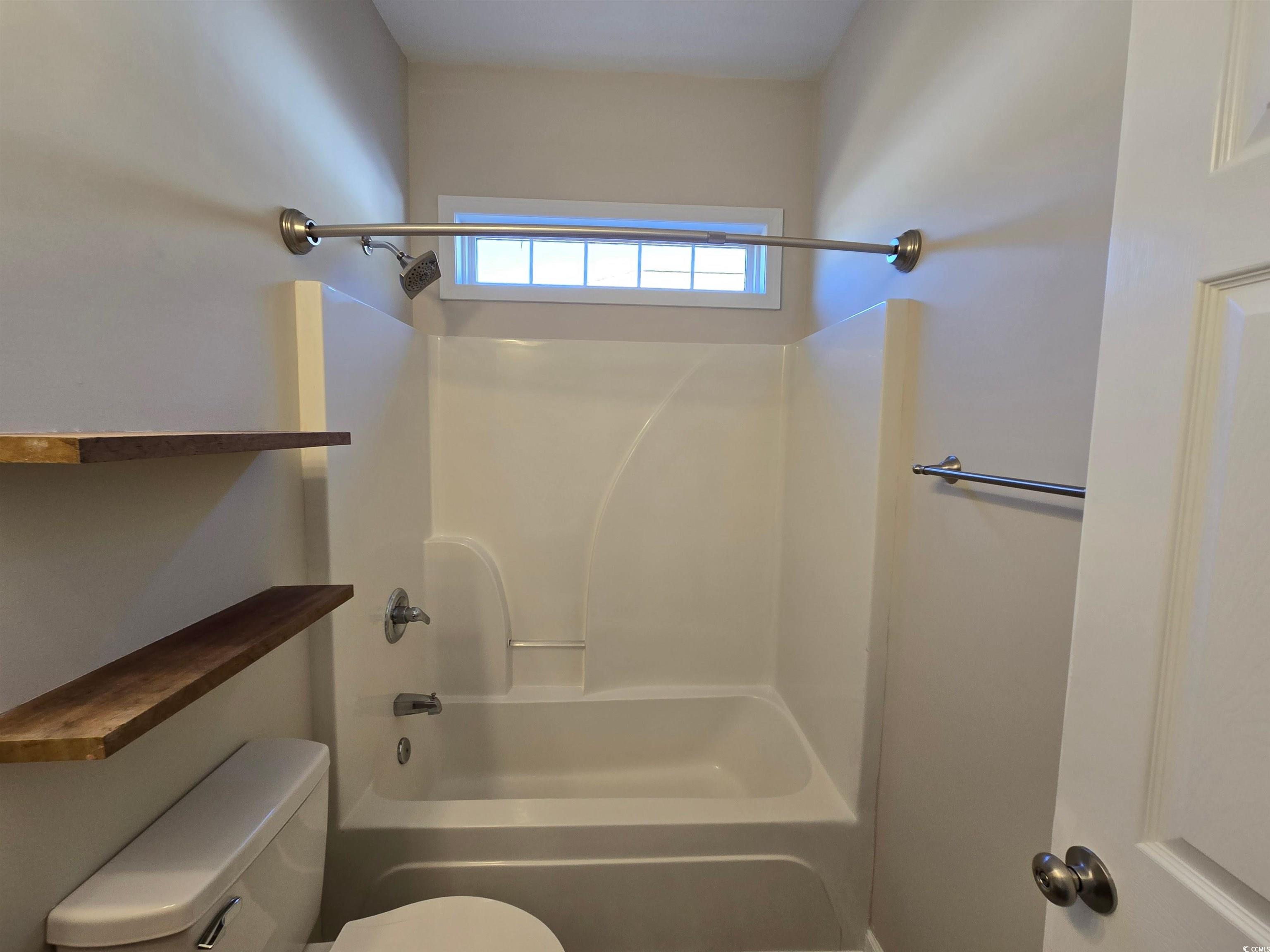 129 Powder Springs Loop Myrtle Beach, SC 29588 - Photo 17 of 23 Bathroom with shower / bathtub combination and toilet