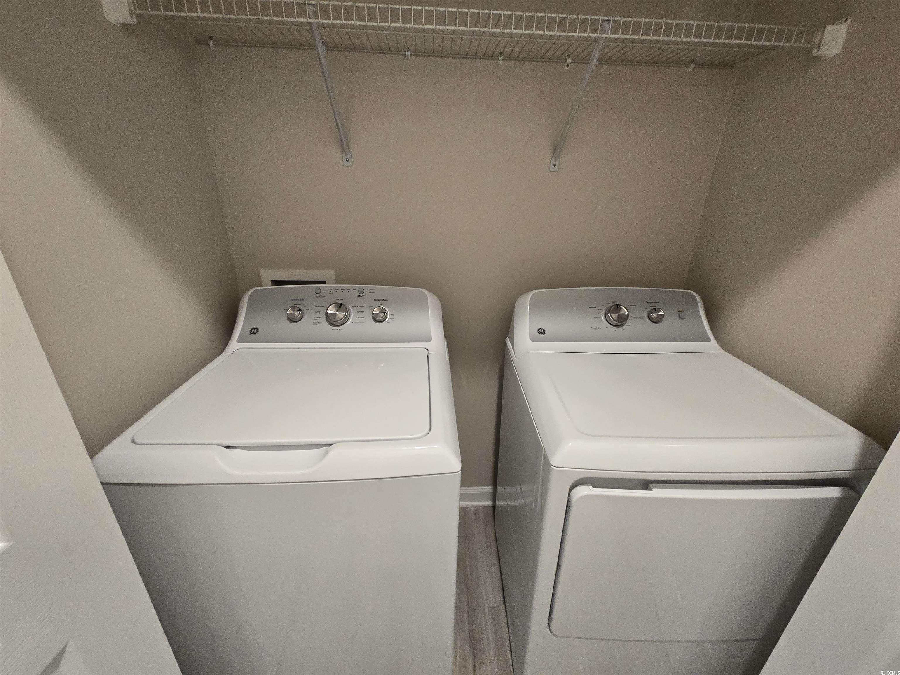 129 Powder Springs Loop Myrtle Beach, SC 29588 - Photo 19 of 23 Washroom featuring washing machine and dryer and wood finished floors