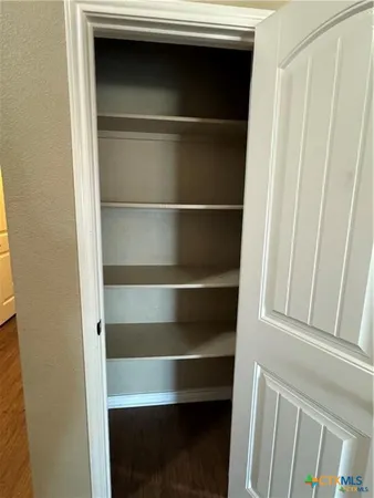 a kitchen with stainless steel appliances a refrigerator and a stove