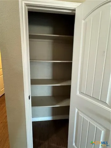 a kitchen with stainless steel appliances a refrigerator and a stove