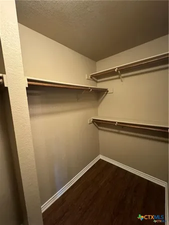 a view of an empty walk in closet