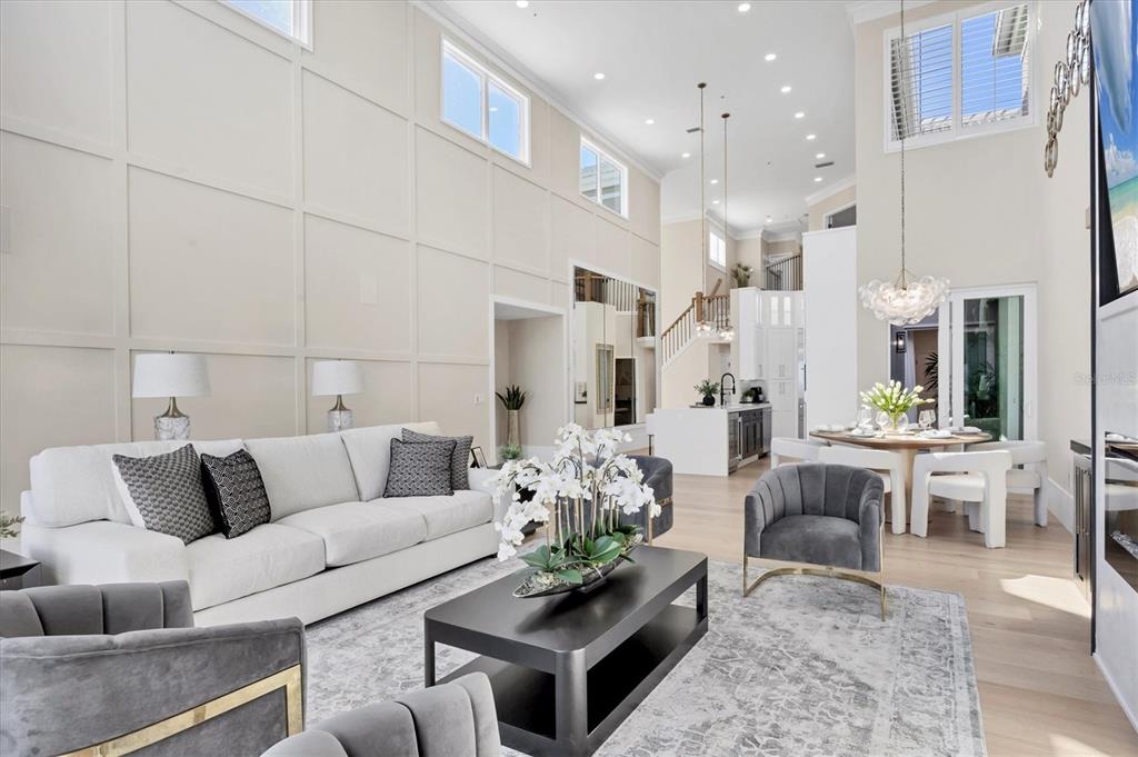 3540 Mistletoe Lane Longboat Key, FL 34228 - Photo 12 of 80 a living room with furniture potted plant and kitchen view