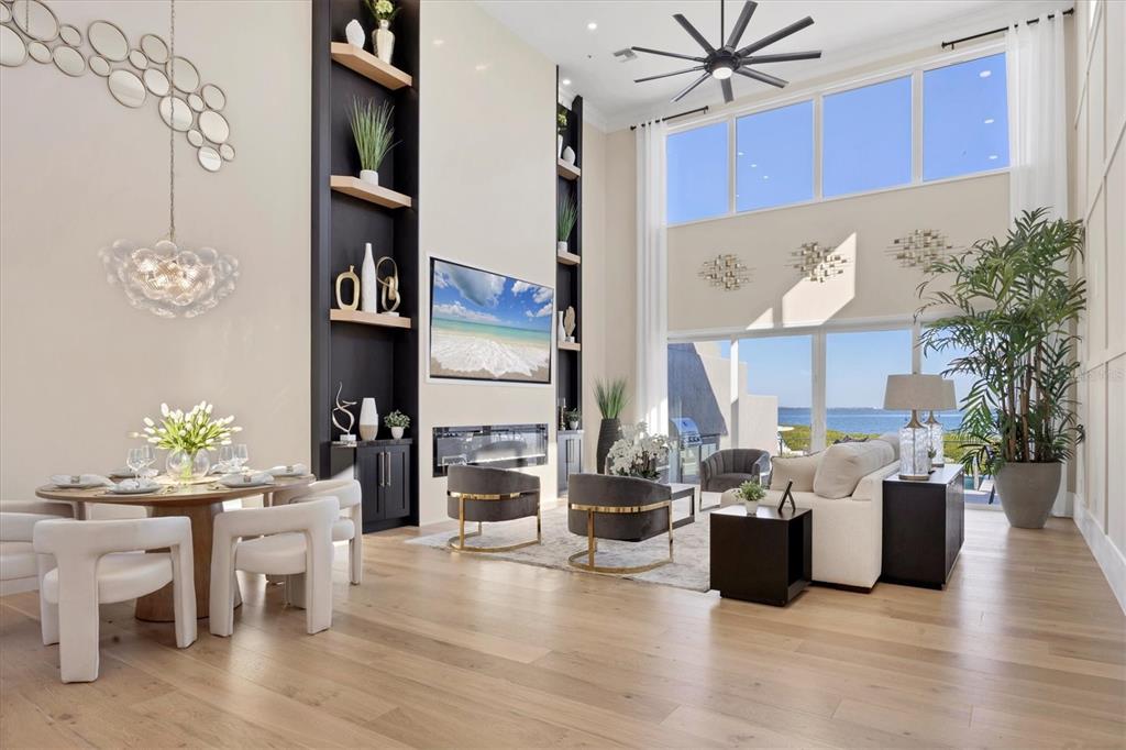 3540 Mistletoe Lane Longboat Key, FL 34228 - Photo 15 of 80 a view of a dining room with furniture and wooden floor